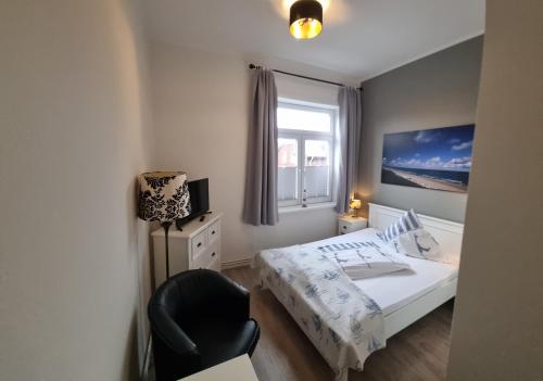 Postel nebo postele na pokoji v ubytování Hotel-Cafe-Lindow