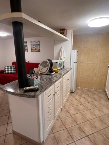 a kitchen with a counter with a stove at Il Balconcino in Gaeta