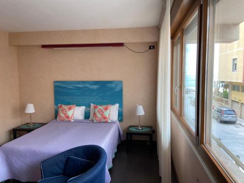 Postel nebo postele na pokoji v ubytování Mare Nostrum Petit Hôtel