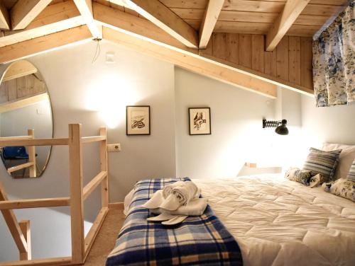 a bedroom with a bunk bed and a ladder at Grimani Pension in Nafplio