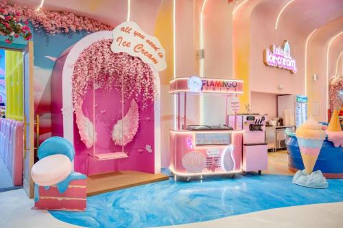 a little girls room with a barbie kitchen and a hello kitty room at Flamingo Hải Tiến - Thanh Hóa in Thanh Hóa