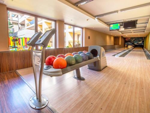 a bowling alley with balls in a lane at Oddych v Rajeckých Tepliciach v samostatnom rodinnom dome in Rajecké Teplice
