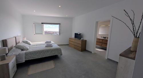 Katil atau katil-katil dalam bilik di Casa Sol Tu refugio de relax en Lanzarote
