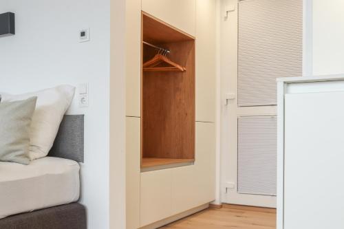 a small bedroom with a bed and a closet at Säntisblick Apartment in Schwarzach