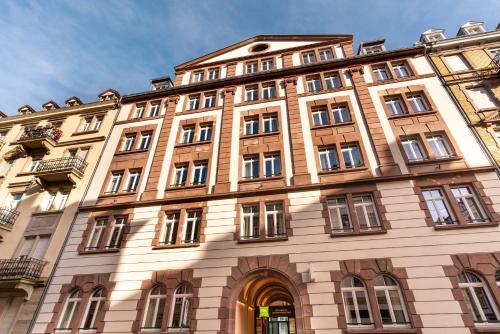 a large building with a lot of windows at Ibis Styles Strasbourg Centre République in Strasbourg
