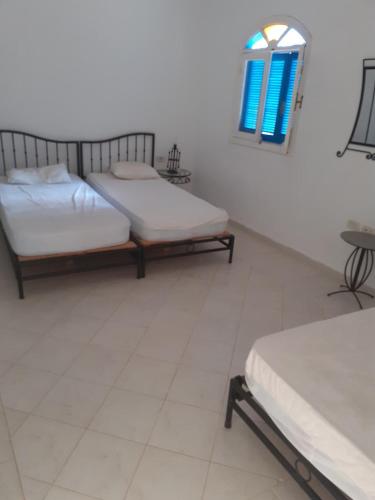 Ένα ή περισσότερα κρεβάτια σε δωμάτιο στο Villa Djerba Jack