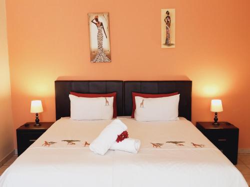 Postel nebo postele na pokoji v ubytování Capbon Guesthouse