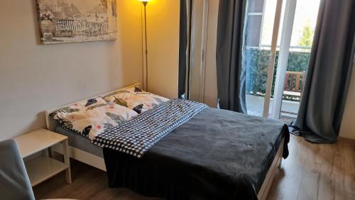 Posteľ alebo postele v izbe v ubytovaní Apartament Wyszyńskiego 10