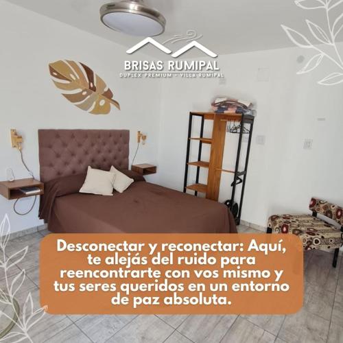 a bedroom with a bed and a sign on the wall at Brisas Rumipal dúplex premium Villa Rumipal in Villa Rumipal