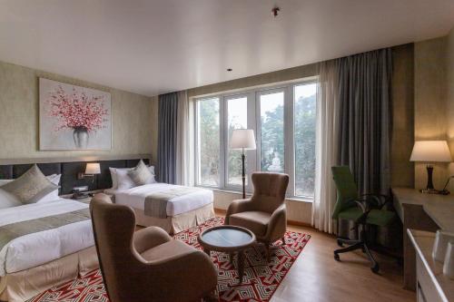 Postel nebo postele na pokoji v ubytování Hotel Ashwatth