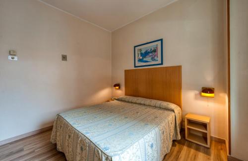 a small bedroom with a bed in a room at Hotel Barsotti in Brindisi