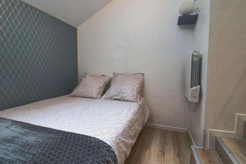 Ένα ή περισσότερα κρεβάτια σε δωμάτιο στο Haut des pipots