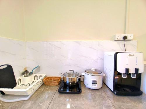 a kitchen counter with a blender and a coffee maker at Newcastle Seri Impian Snooker Ping Pong Neflix in Kluang