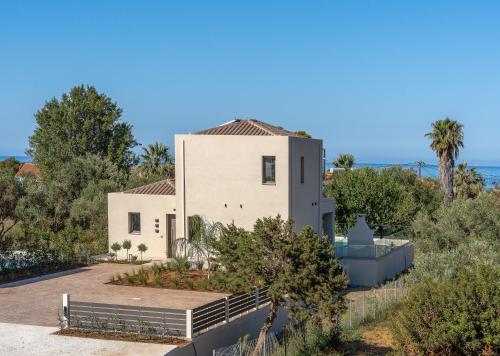 a villa with a view of the ocean at Villa Melina - Elysian Villas Kefalonia, 200m from Beach, New 2024 in Minia