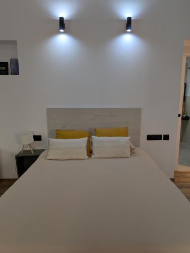 Ένα ή περισσότερα κρεβάτια σε δωμάτιο στο Las Arenas Suites 3