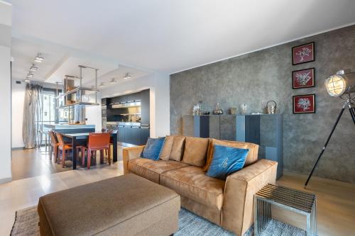 a living room with a couch and a table at Dimora Einaudi in Alba