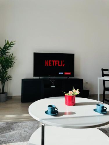 a coffee table in a living room with a tv at The Hive Retreats in Yas Island in Abu Dhabi