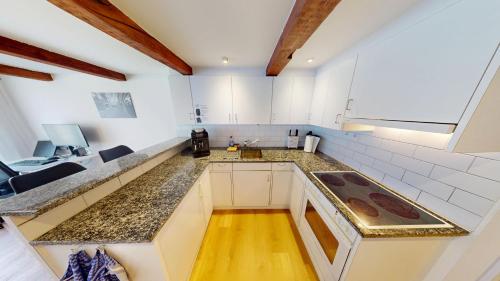 Kuchyň nebo kuchyňský kout v ubytování Zentral Altstadt Chur - Bahnhofsnah - Ferienwohnung - Bernina Express - Solution-Grischun