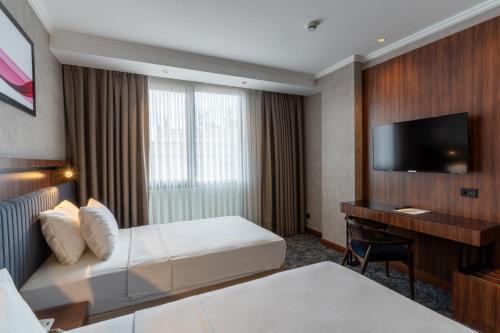 Postel nebo postele na pokoji v ubytování Ramada by Wyndham Gaziantep