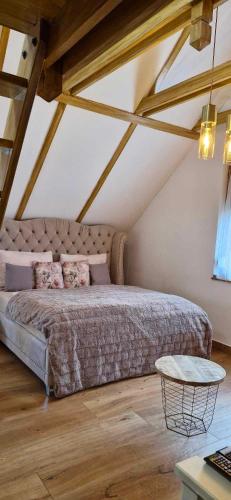 Postel nebo postele na pokoji v ubytování Bátory Luxury Apartman