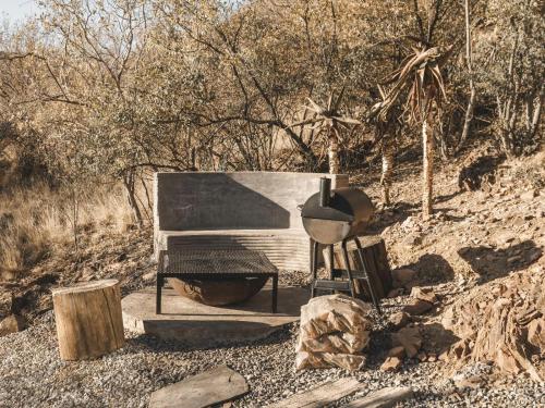 a grill sitting on the side of a hill at Thaba eNtle Private Boutique Game Farm in Thabazimbi
