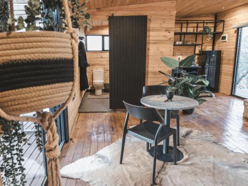 a room with a table and chairs in a building at Thaba eNtle Private Boutique Game Farm in Thabazimbi