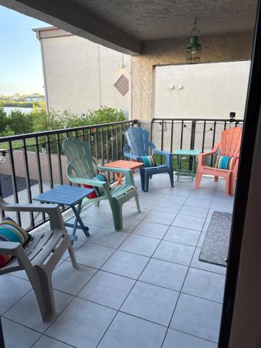 a group of chairs and tables on a patio at Sea Club Condo #37 in Clearwater Beach