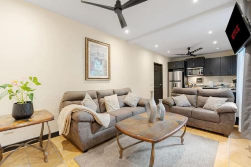 a living room with a couch and a table at Suite 3 Jaguar - Beach & Pool 2 BR Condo in Brasilito