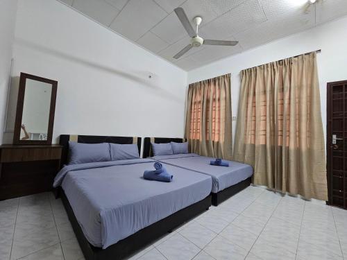 Postel nebo postele na pokoji v ubytování Sunrise Hostel