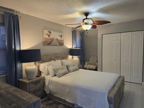 a bedroom with a bed and a ceiling fan at Green Keys Ranch in Homestead