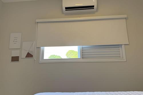 Postel nebo postele na pokoji v ubytování Sofisticado apartamento com ar cond. em Araxá