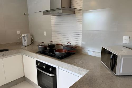 Kuchyň nebo kuchyňský kout v ubytování Sofisticado apartamento com ar cond. em Araxá