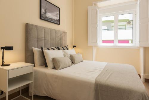 Ένα ή περισσότερα κρεβάτια σε δωμάτιο στο City Rooms Guest House by HD