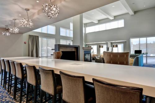a large conference room with a long table and chairs at Residence Inn by Marriott Jackson The District at Eastover in Jackson