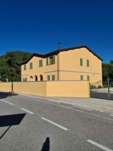 a building on the side of a road at CasArmando Casa Vacanze in Foligno