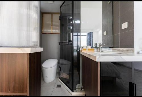 a bathroom with a shower and a toilet and a sink at jackson house in Markham