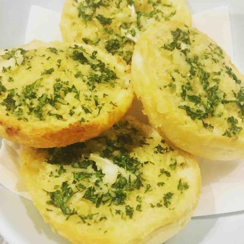 a pile of garlic knots with parsley on them at The Cowshed Cottage on The Greenway in Dungarvan