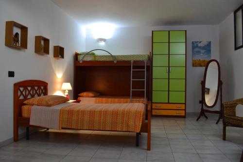 Postel nebo postele na pokoji v ubytování TAVERNETTA DEL BORGO