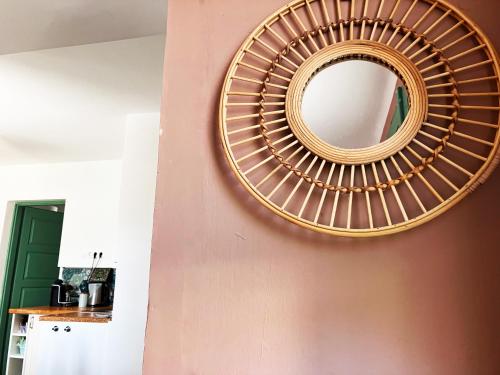 a mirror on a wall in a room at Julesence apartman Lesencetomaj in Lesencetomaj