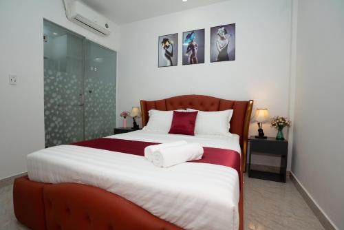 Postel nebo postele na pokoji v ubytování The Eros Hotel