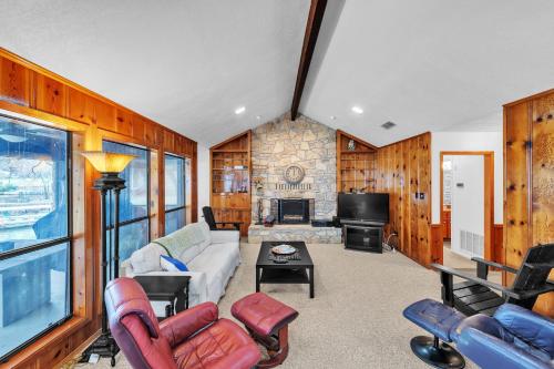 a living room filled with furniture and a fireplace at Lake House at Granbury home in Granbury