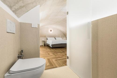 Ένα ή περισσότερα κρεβάτια σε δωμάτιο στο aMate' Luxury slow living by BarbarHouse