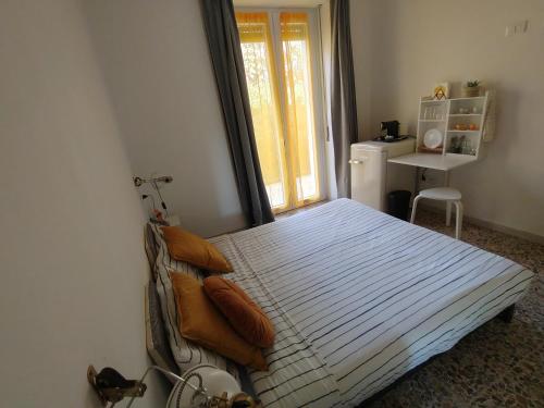 Postel nebo postele na pokoji v ubytování PortoCielo Yoga e Mare