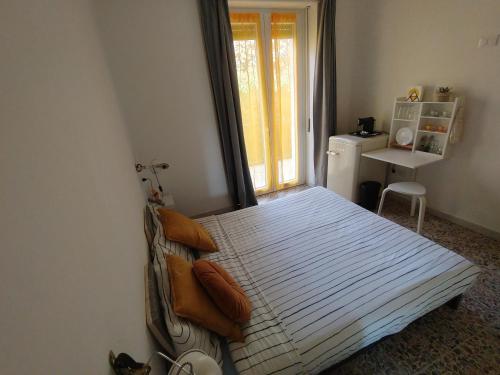 Postel nebo postele na pokoji v ubytování PortoCielo Yoga e Mare