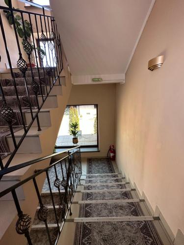 a hallway with stairs and a window at coliseum in Calafat