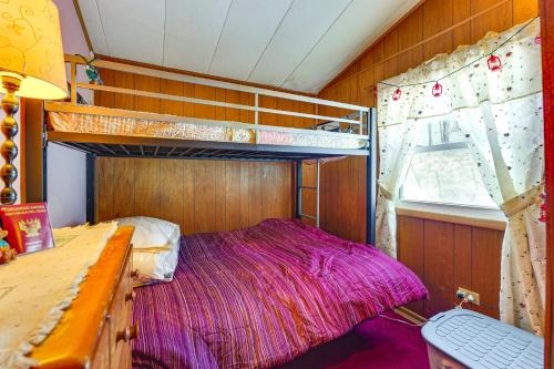 a bedroom with two bunk beds and a desk at Hike, Ski and Unwind Cabin with Deck in Chester! in Chester