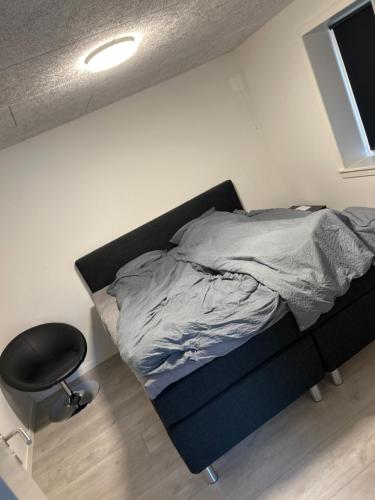 Postel nebo postele na pokoji v ubytování Tranevejs hytten