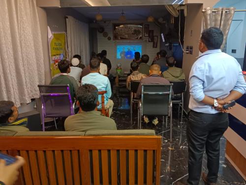 a man standing in front of a group of people in a room at THE VISTA RESIDENCY in Guwahati