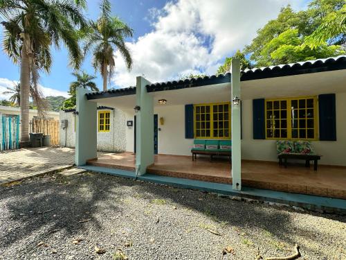 a house with a porch with a bench on it at Rainforest View with Spa 4 Bed 3 Bath Sleeps 8 in Rio Grande