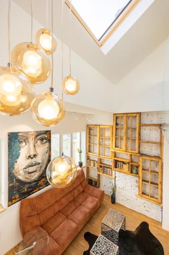 a living room with a couch and a painting on the wall at Apartment Musala N 04 in Varna City